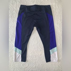 Athleta black leggings with color block accents never worn, size XL.